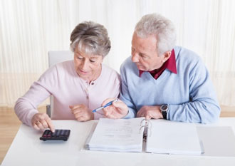 Senior couple examining their finances